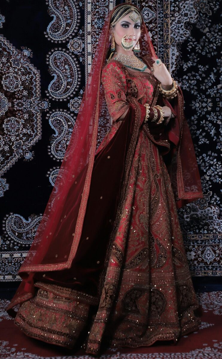 Beautiful Indian bride in traditional red lehenga with intricate jewelry in Mumbai, India.