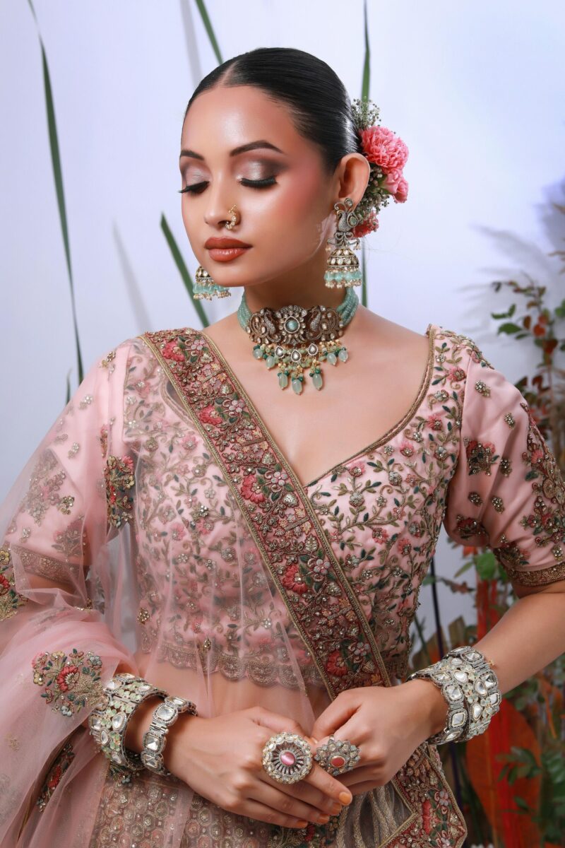 Captivating portrait of an Indian bride in traditional attire with floral details in Delhi.